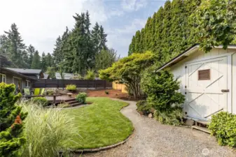 A large garden shed offers great storage for tools and outdoor supplies