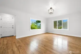 Large living room entrance with gorgeous hardwood floors