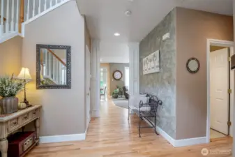 Flawless hardwoods from the entry to the kitchen.