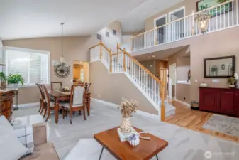 ...and a grand staircase overlooking formal areas and foyer.