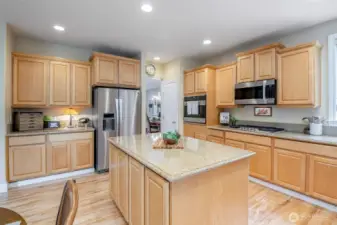 In-kitchen pantry, command center/butler's kitchen & plethora of storage, even at the island!