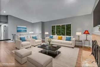 Living room upstairs with wood fireplace, spacious and inviting!