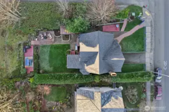 birds view of the newer roof and manicured yard