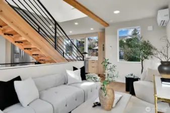 the central open stair to the penthouse level creates an air of sophistication on this cool pad.