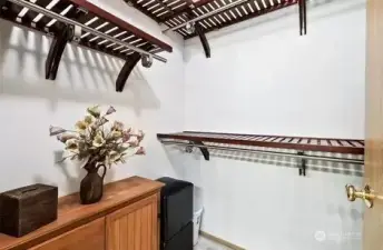 Walk-in closet that has ample space for all your hats, shoes, and clothes!