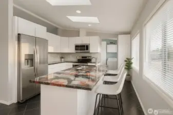 Gorgeous remodeled kitchen with great natural light, island counter and breakfast bar.