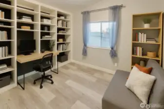 Third bedroom doubling as a office space with beautiful built in bookcases!