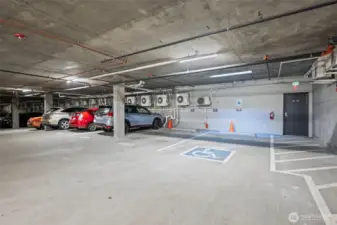 the convenience just keeps going. TWO dedicated parking spots located next to the access door across from the elevator.