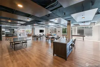 Complete with two separate kitchens, TV's seating throughout, shuffle board, ping-pong table. This room truly has it all.