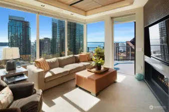 Second Family Room with lovely views, fireplace, clear straight grain white oak ceiling and deck.