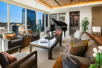 Elegance and sophistication are exemplified in this generous-sized Living Room with space for grand piano. Custom built-ins, clear grain cedar ceiling, automatic controlled lighting and automatic Lutron Blind complete this room.