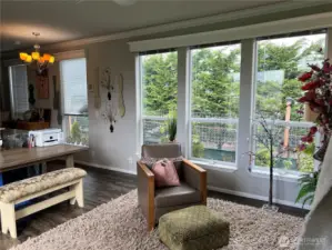 Large windows bring in lots of light into this comfortably sized living room.