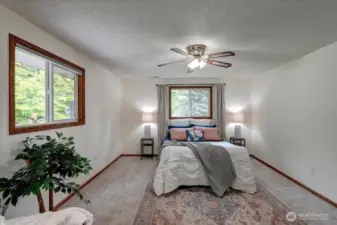 Privately situated & overlooking the lush back yard, there is a slider to a deck to the left of this photos where you can enjoy your morning coffee or favorite evening beverage