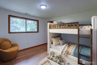 The main level bedroom offers laminate floors and a generous closet. *Room is virtually staged