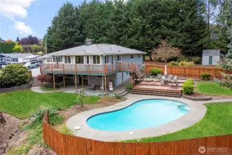 Enjoy the dog days of summer in your in ground pool with patio surround and lots of deck area for outdoor dining & relaxation
