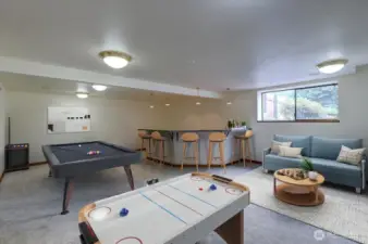 Host an indoor pool party, game night or watch the big game in the enormous bonus room. The custom epoxy bar is plumbed for water so you can create a bar or added kitchen space for generational living. *Room is virtually staged