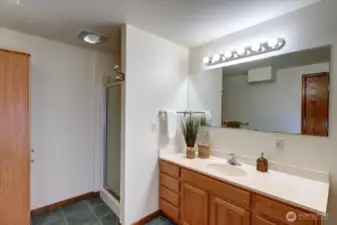 The lower level 3/4 bath with tile flooring serves the added living/bedroom spaces and creates so many options for generational living