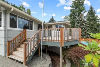 The front entry overlooks the lush, established landscaping