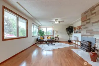 Beautifully updated wood wrapped windows keep the spaces bright & cheery