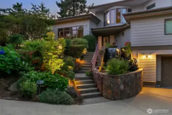 Front stairs and waterfall are lighted at night.