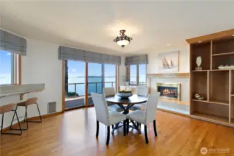 Non formal dining with fireplace and slider to lower deck.