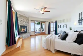 Primary Suite with fireplace & automatic blinds
