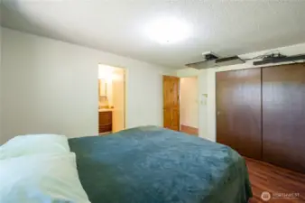 Primary bedroom with adjoining full bathroom.