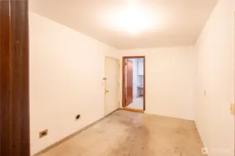 Laundry, utility & storage room, the door leads to garage.