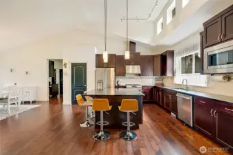 Entertain with ease in the expansive formal dining room, bathed in natural light and perfectly suited for both intimate dinners and large gatherings.