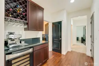 Butler's pantry with wine rack and beverage cooler.