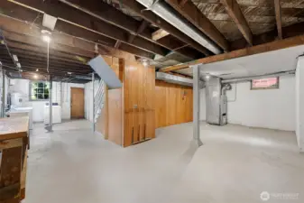 Unfinished lower level with high ceilings and outside access, tons of potential for added living space or ADU