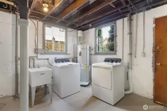 Lower level utility room with new washer and dryer.
