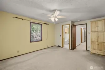 Spacious Primary Bedroom with Ceiling Fan and Attached Bathroom