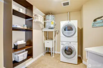 Oversized Utility room with new hot water heater.