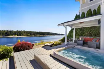 Imagine yourself soaking up the sun on the expansive two-tiered deck with hot tub and covered outdoor seating. You can feel the ocean breeze and hear the waves from the shore.