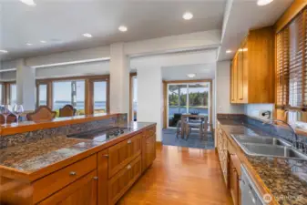 Kitchen great for gatherings with custom cabinets with tons of storage, granite oountertops, charming breakfast dining area and views gaolore!