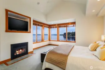 Primary expansive bedroom with gas fireplace, luxurious views and enormous walk-in closets