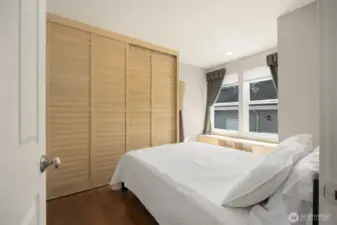 Bedroom in the apartment living space with built-in closets