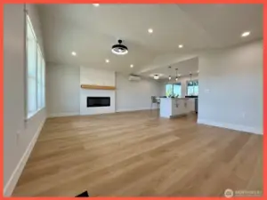 Bright and airy great room with vaulted ceilings and fireplace with wood mantle for those PNW chilly evenings.