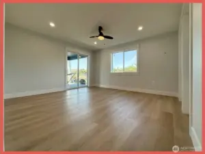 Relax in this primary ensuite featuring a door to the back covered deck. This space is located on the back NW corner of the home.