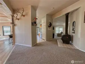 View of open office space to dining, kitchen, living room