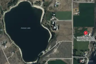 Aerial view of property and Aeneas Lake