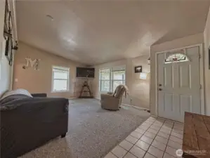 Living room and main entrance with ceramic tile entry