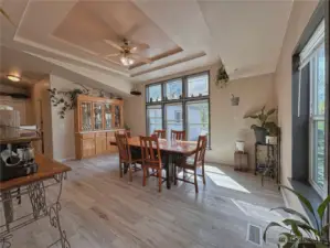 Large room with tray ceiling design currently used as dining space or the perfect location for a 2nd living room/family room