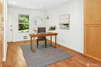 Just off the kitchen is the office/den with walls of built-in cabinetry space. From this room you can easily get to the backyard, garage and front yard.