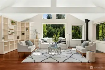 Welcome inside to bright walls of windows and dramatic vaulted ceilings.