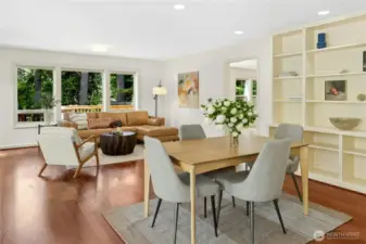 Walls of windows look out to the grounds and custom bookcases line the walls. You have convenient spaces and good storage here for all your books and treasures.