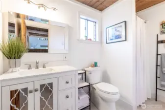 Bathroom, new vanity, mirror and toilet.