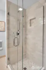 Primary bathroom has a remodeled shower