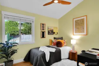 The second bedroom has the same vaulted ceiling and fan